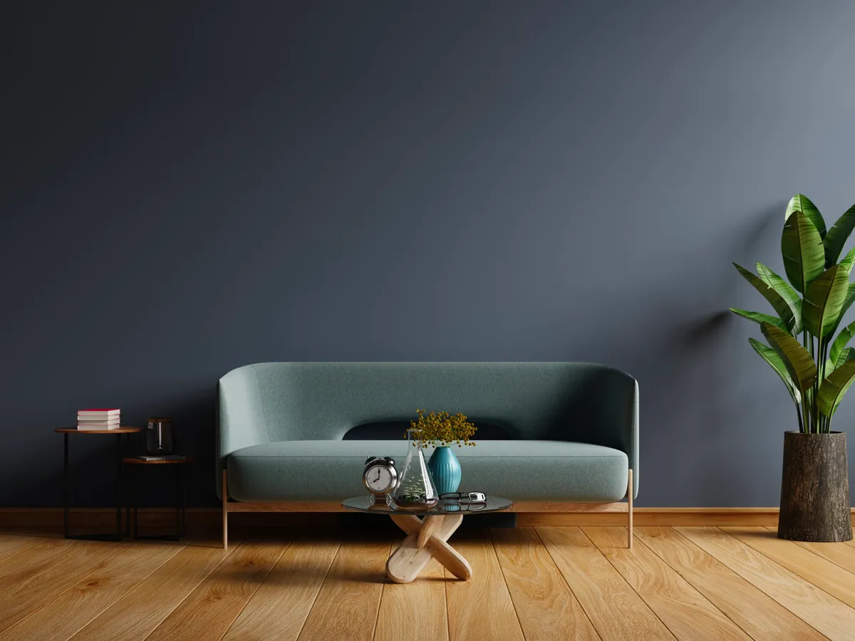 A green sofa in a calm, modern room